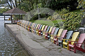 High angle view of the multi-coloured Muskoka Chairs in the tourist resort with the patio gazebo