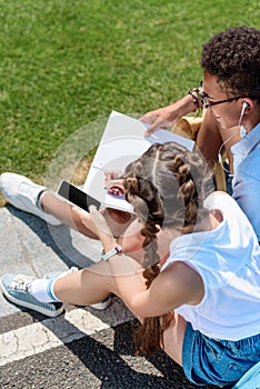 high angle view of multiethnic teenage boy and girl