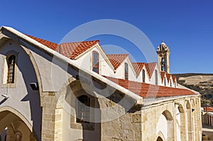 High angle view of the orange tiles and building roofs in the Old Town with the top of its landmark bell tower clearly