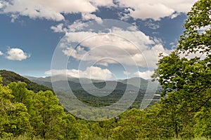 High-angle view over green Blueridge parkway and mountains cloudy sky sunlight, SC, USA