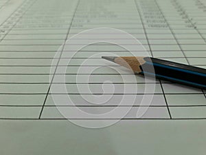 High Angle View Of Pencils On Table Against White Background.