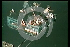 High angle view people escaping across river on raft