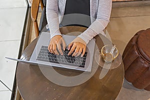 High angle view photo of woman hand typing laptop keyboard