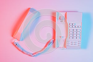 high angle view pink retro landline telephone with receiver. High quality photo