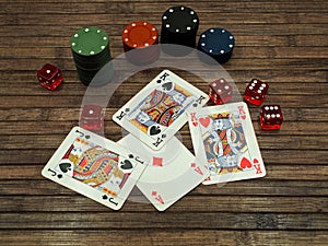 High-angle view of poker cards, chips, and dice on the wooden surface