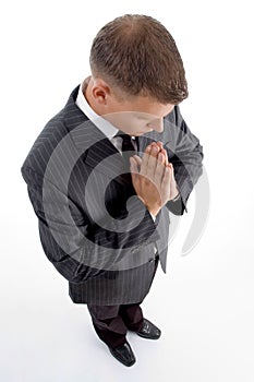 High angle view of praying businessman