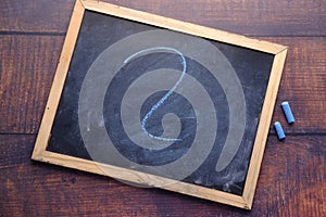 High angle view of question mark on chalkboard