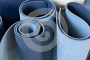 High angle view of rolled blue color yoga mat texture background