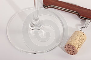 High angle view with shallow depth of field of a glass of red wine with a sommelier tools