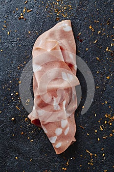 high angle view of a slice of mortadella