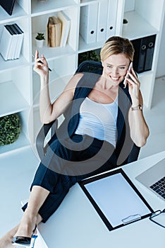 high angle view of smiling businesswoman