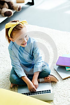 high angle view of smiling redhead child