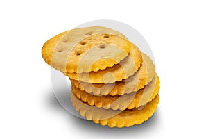 High angle view stack of crunchy salted round crackers isolated on white background