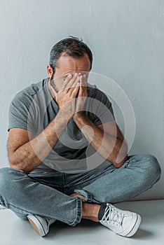high angle view of stressed middle aged man
