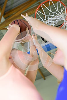 High angle view three young men playing basketball