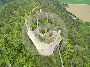 high angle view to a castle ruin in the woods