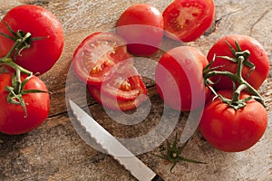 High-angle view of tomatoes on rustic wooden table