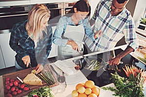 High angle view of trio cooking a meal