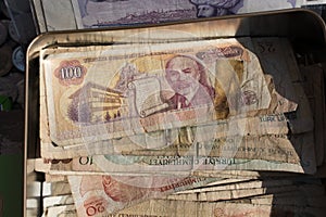 High angle view of Turkish old Liras in a metallic box under the lights