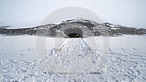 High angle view of water hole in frozen lake.