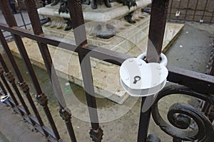 High-angle view of a white heart-shaped lock on a fence - eternal love symbol