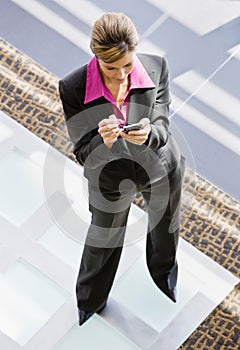 High angle view of woman writing in organizer