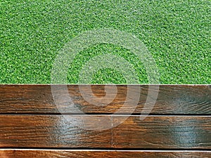 High Angle View of Wooden Plank Floor and Green Grass Field