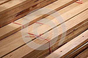 Wooden planks stack for construction material background