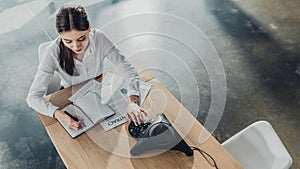 high angle view of young happy businesswoman