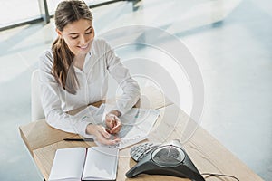 high angle view of young happy businesswoman