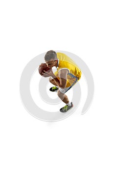 High angle view of young man, basketball player with a ball training isolated on white studio background. Advertising