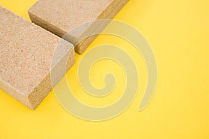 High angshot of building thermal insulation materials isolated on yellow background