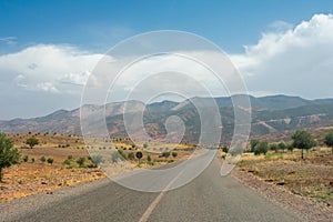 High atlas mountains in Morocco, North Africa. Empty asphalt road, beautiful landscape, sunny day