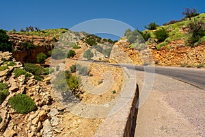 High atlas mountains in Morocco, North Africa. Empty asphalt road, beautiful landscape, sunny day