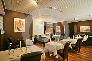 High backed brown chairs in a restaurant