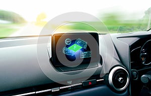The high battery capacity symbol is displayed on the screen in the EV electric car. EV car battery is fully charged while travelng