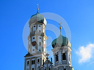 High bell tower with onion dome Gothic church architecture in blue sky