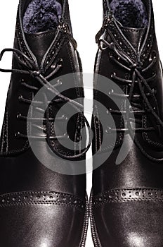 High black winter boots with lacing and lock on the thick sole, of leather and fur