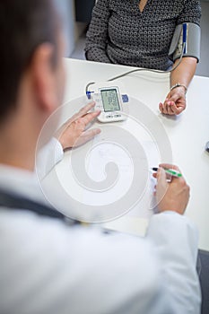 High Blood Pressure checking blood pressure of the patient in hospital