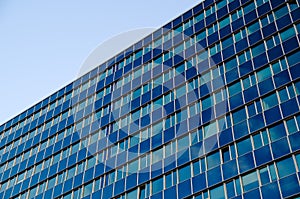 A high blue glass office building