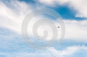 High blue sky with feathery clouds. The sky is a symbol of vastness, freedom, and air