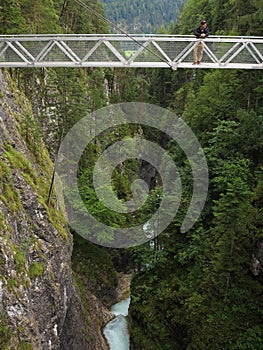 High bridge over gorge with man