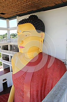 High Buddha statue in a Buddhist temple, Weherahena, Matara