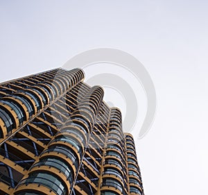 High building with rounded balconies view from the bottom up