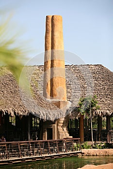 High chimney of clay in Biopark photo
