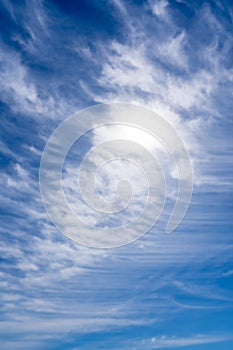 High cirrus clouds against the blue sky