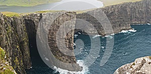 High cliff in Faroe Islands photo