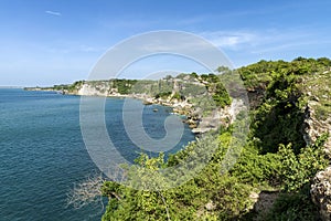 High cliffs with beautiful foliage with blue sky.