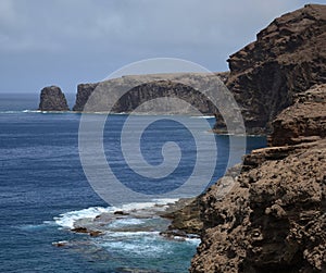 High cliffs and Roque Farallon, Galdar, Gran Canaria photo