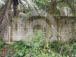 High concrete wall barrier from trespass into property